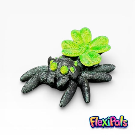 Articulated lucky spider with four-leaf clover on its back